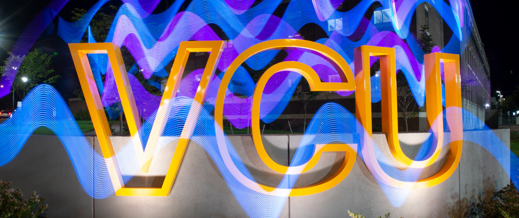 Gold VCU sign with blue and purple graphic elements overlaid.